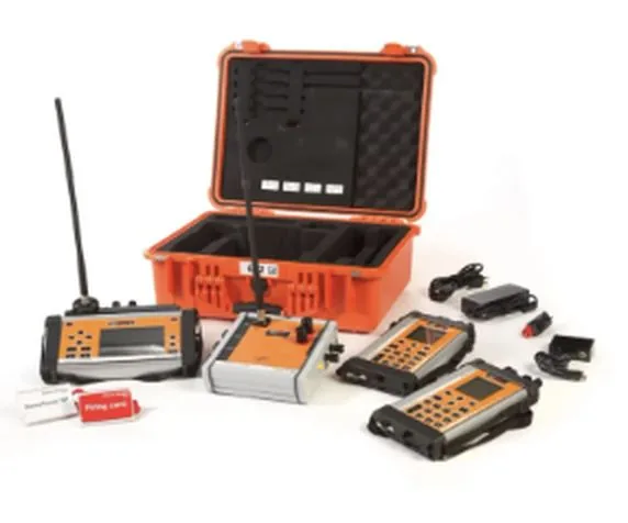 An electronic initiation system: a blasting machine in its transport case, two programming units and their accessories, on a white background.